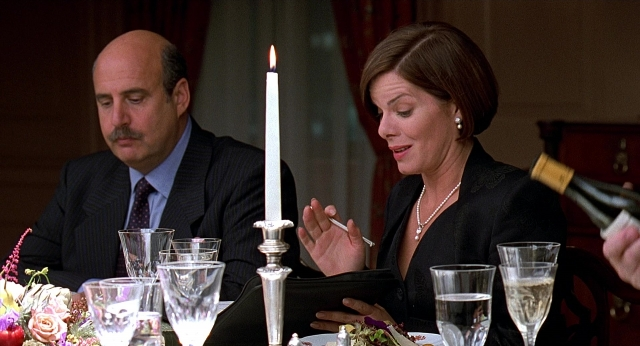 Wide shot frame from Meet Joe Black — sitting, room, table