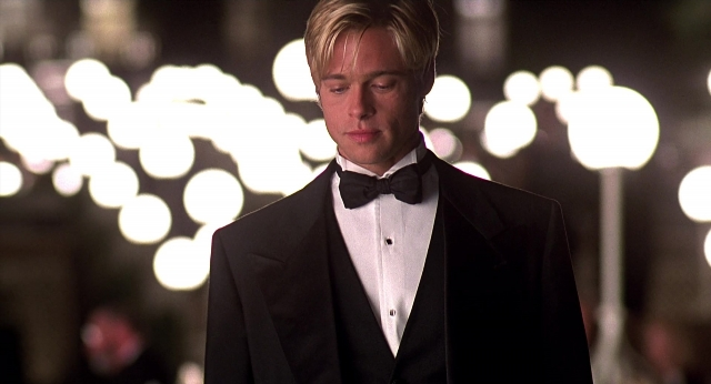 Medium shot frame from Meet Joe Black — standing, room, suit