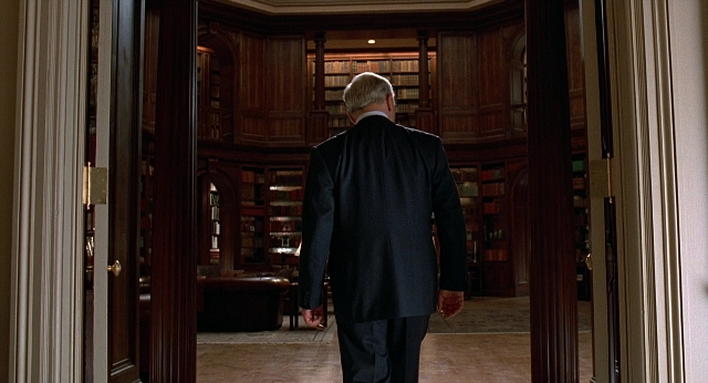 Wide shot frame from Meet Joe Black — walking, room, door