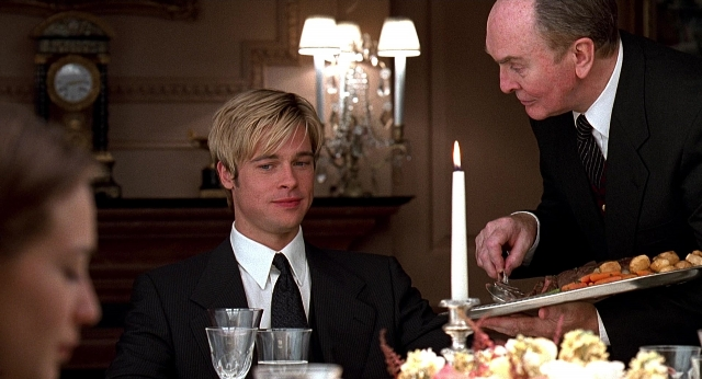Wide shot frame from Meet Joe Black — sitting, plate, room