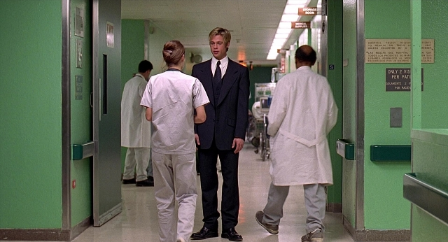 Wide shot frame from Meet Joe Black — walking, room, door