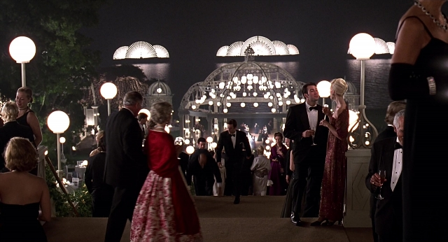 Wide shot frame from Meet Joe Black — standing, night, dress