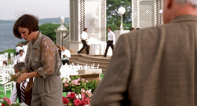 Wide shot frame from Meet Joe Black — standing, walking, suit