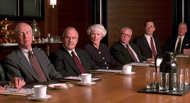 Wide shot frame from Meet Joe Black — sitting, room, table