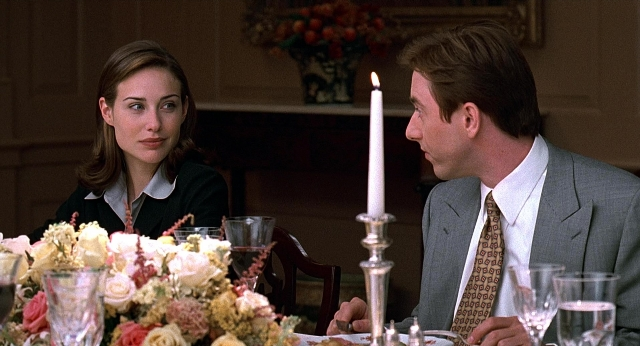 Wide shot frame from Meet Joe Black — sitting, room, table