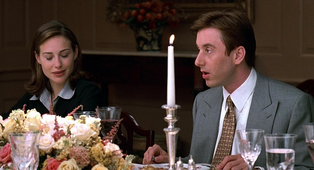 Wide shot frame from Meet Joe Black — sitting, table, suit
