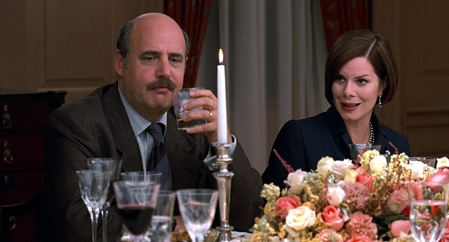 Wide shot frame from Meet Joe Black — sitting, table, suit