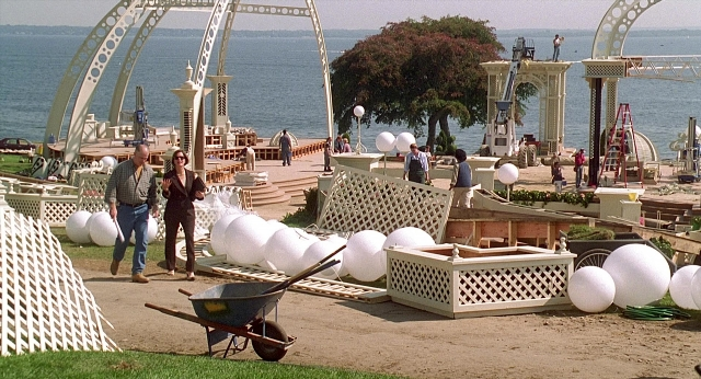 Wide shot frame from Meet Joe Black — walking, cart, wheel