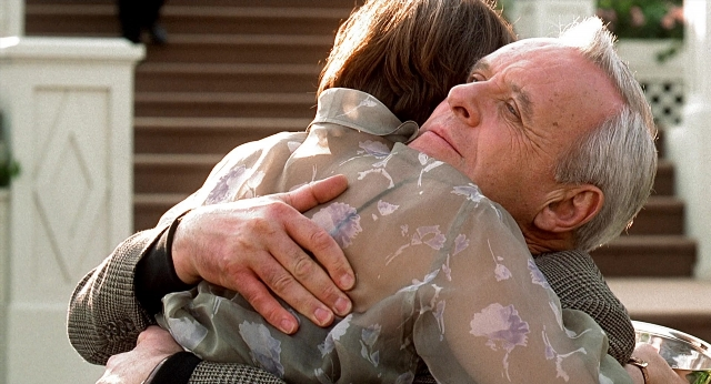 Wide shot frame from Meet Joe Black — standing, kiss, shirt