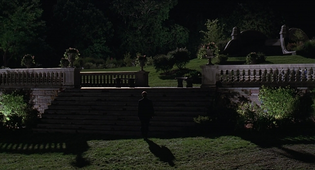 Wide shot frame from Meet Joe Black — standing, walking, night