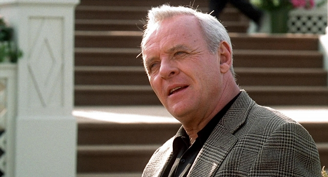 Wide shot frame from Meet Joe Black — suit, shirt, face