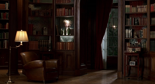 Wide shot frame from Meet Joe Black — book, room, table