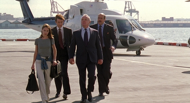 Wide shot frame from Meet Joe Black — walking, suit, tie