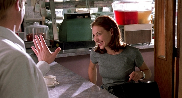 Wide shot frame from Meet Joe Black — sitting, hand, shirt