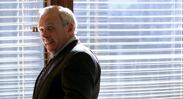 Frame from Meet Joe Black — standing, room, suit