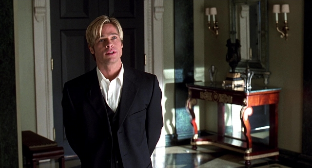 Wide shot frame from Meet Joe Black — standing, table, mirror