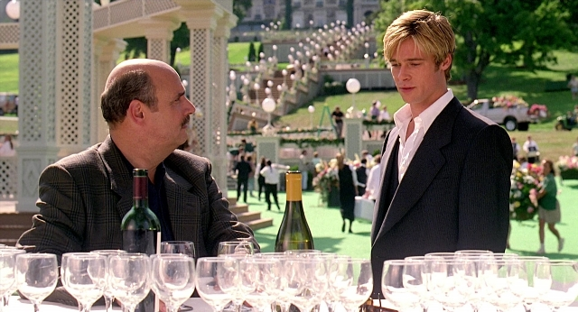 Wide shot frame from Meet Joe Black — sitting, walking, table