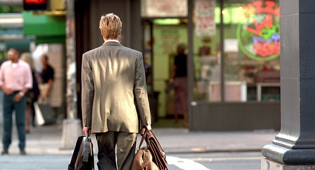 Wide shot frame from Meet Joe Black — walking, street, coat
