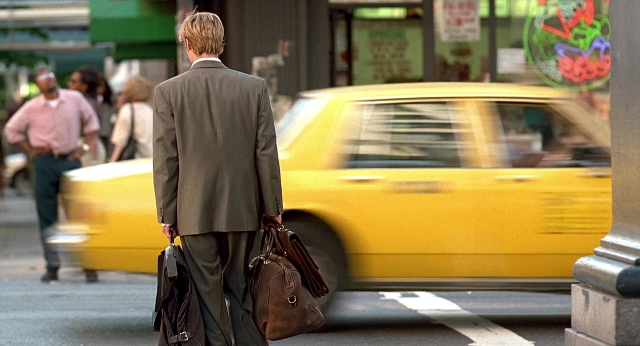 Wide shot frame from Meet Joe Black — walking, street, car