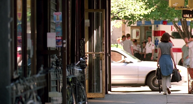 Wide shot frame from Meet Joe Black — standing, walking, door