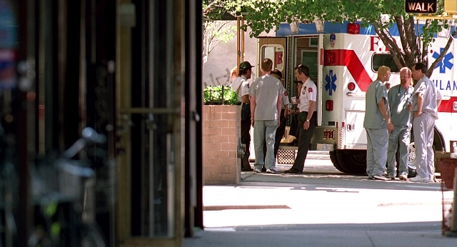 Wide shot frame from Meet Joe Black — standing, dialogue, street