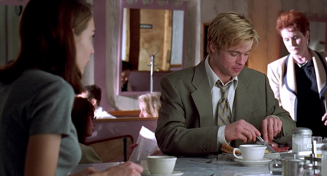 Wide shot frame from Meet Joe Black — sitting, standing, plate