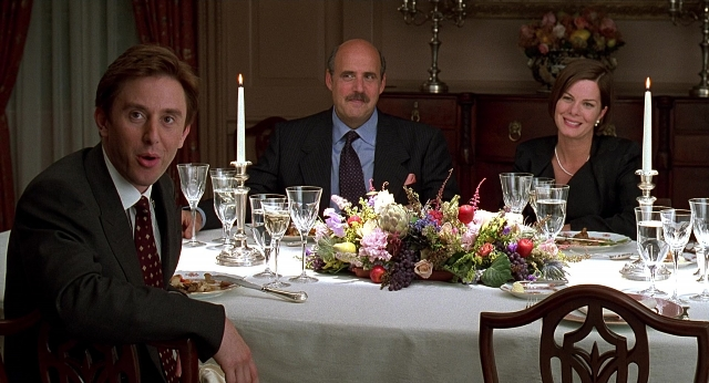 Medium shot frame from Meet Joe Black — sitting, table, dialogue
