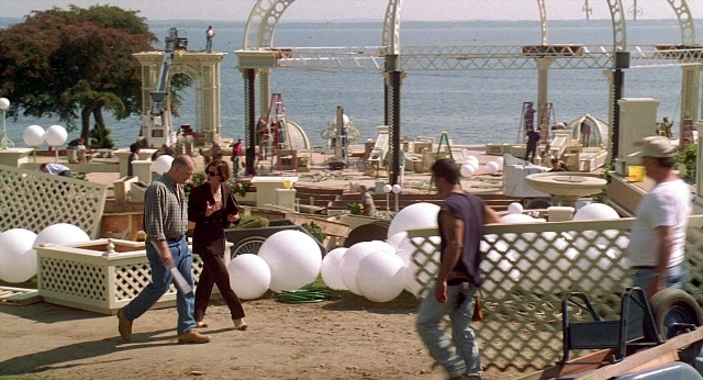 Wide shot frame from Meet Joe Black — walking, sea, person
