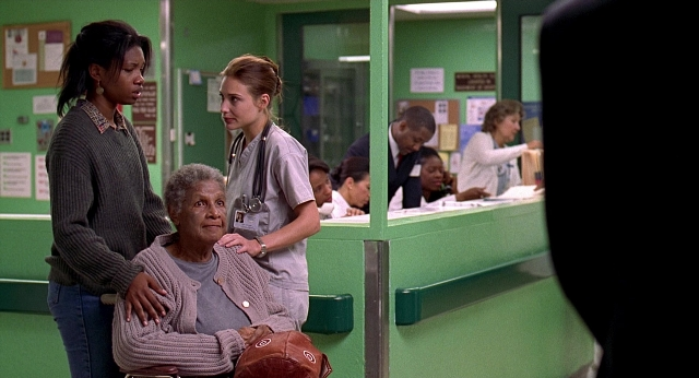 Wide shot frame from Meet Joe Black — sitting, standing, room