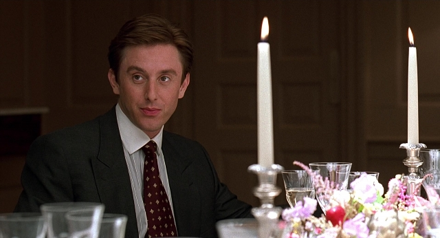 Wide shot frame from Meet Joe Black — sitting, room, table