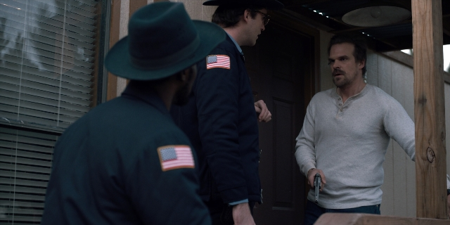 Wide shot frame from Stranger Things — standing, room, dialogue