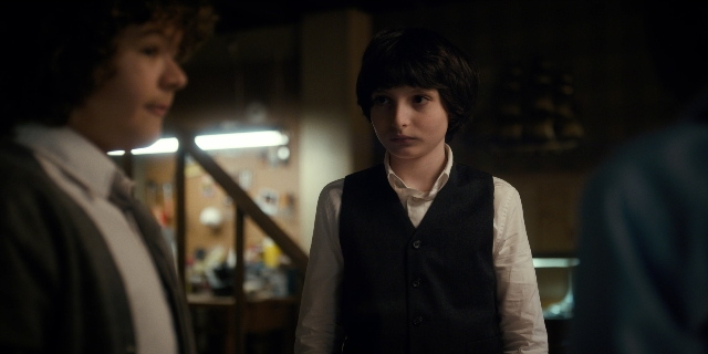 Wide shot frame from Stranger Things — standing, room, kitchen