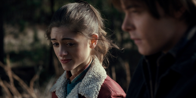 Medium shot frame from Stranger Things — standing, face, hair