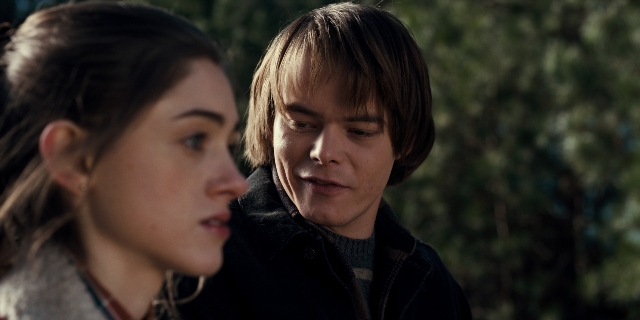 Medium shot frame from Stranger Things — standing, face, hair