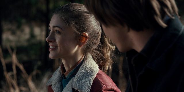 Wide shot frame from Stranger Things — standing, face, hair