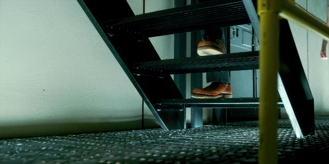 Wide shot frame from Stranger Things — walking, room, person