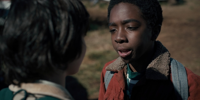 Medium shot frame from Stranger Things — shirt, face, hair