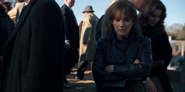 Wide shot frame from Stranger Things — standing, coat, jacket