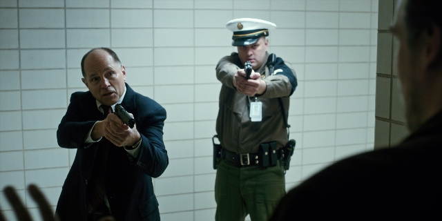 Wide shot frame from Stranger Things — standing, hat, uniform