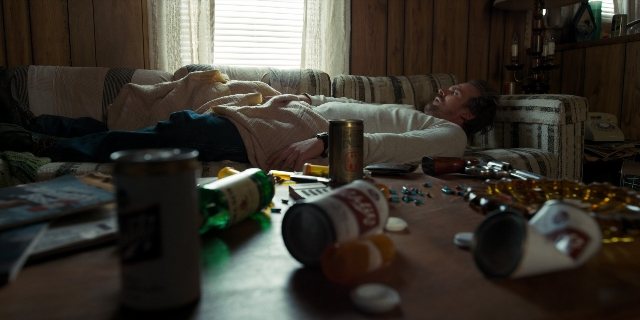 Wide shot frame from Stranger Things — book, room, table