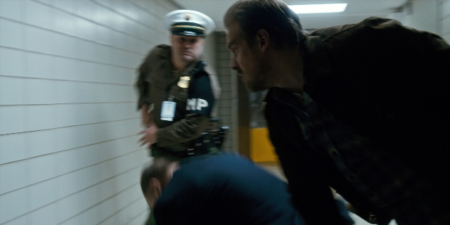 Frame from Stranger Things — standing, dialogue, door