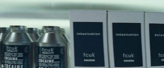 Frame from Layer Cake — hat, bottle
