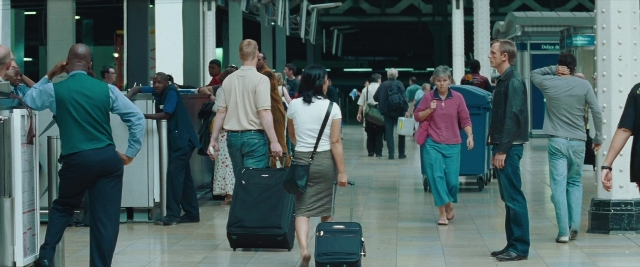 Wide shot frame from Layer Cake — standing, walking, person