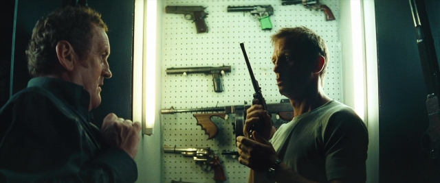 Wide shot frame from Layer Cake — standing, room, dialogue