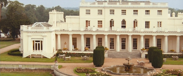 Wide shot frame from Layer Cake — house, fountain
