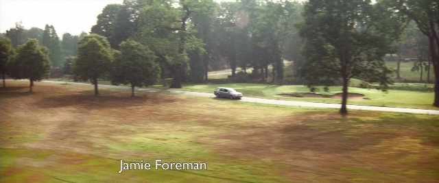 Frame from Layer Cake — street, car