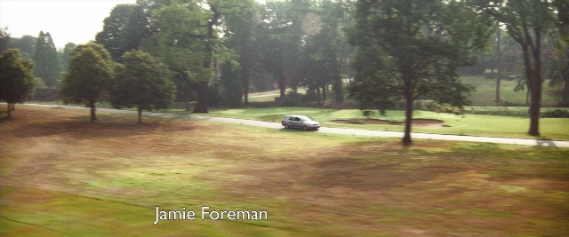 Frame from Layer Cake — street, car
