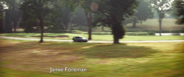 Frame from Layer Cake — street, car