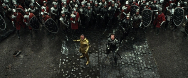 Wide shot frame from Jack the Giant Slayer — standing, street, suit