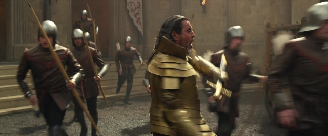 Wide shot frame from Jack the Giant Slayer — standing, walking, street